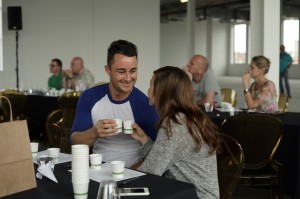 Couple toasting in cupping seminar